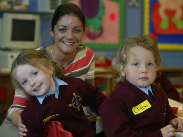 St. Eithne's PS P1 teacher Margreta Green with Ciatlin Quigg and Chloe Ryan on their first day at primary school. (0209JB64):20 YEARS ON: Pictures of Derry children starting primary 1 in September 2003