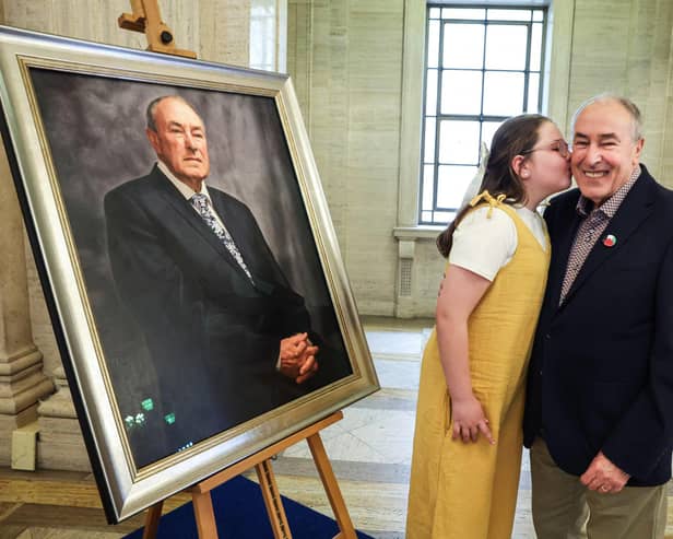 Pictured at the unveiling ceremony is former Speaker of the Northern Ireland Assembly Mitchel McLaughlin and his granddaughter Saorlaith.