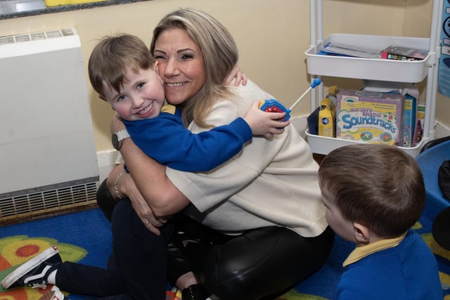 A big hug from Granny during the Holy Child PS Grandparents To School Day. (Photos: Jim McCafferty Photography)