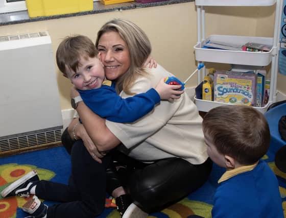 A big hug from Granny during the Holy Child PS Grandparents To School Day. (Photos: Jim McCafferty Photography)