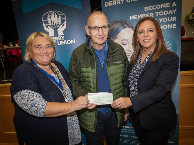 £500 PRIZEWINNER. . . .Mr. John O'Donnell receiving his £500 cheque from Delma Boggs and Sharon Doherty at the Annual General Meeting of, Derry Credit Union on Monday night last.