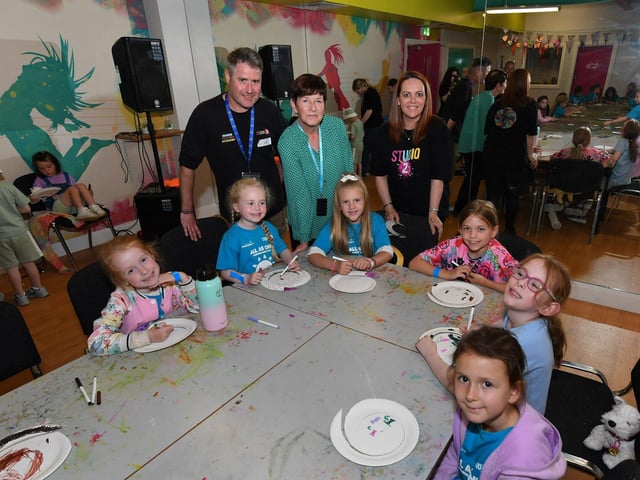 Gareth McAlinden, from Studio 2, and Geraldine Dougan (centre), from Radius Housing Association, pictured with some of the children and volunteers from across the community who participated in the week long Good Relations, arts based, Summer Camps held at Studio. Photo: George Sweeney