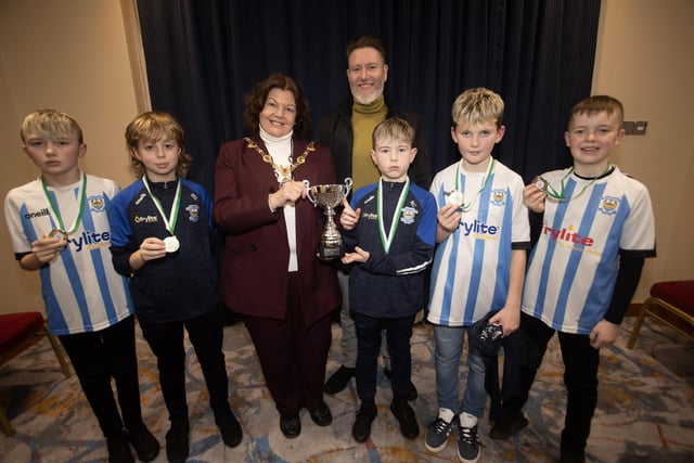 The Mayor, Patricia Logue. pictured at the D&D Youth FA Annual Awards at the City Hotel on Friday night presents Strabane Athletic Colts U11s with the Summer Cup. Included is coach Marcus McDonnell.