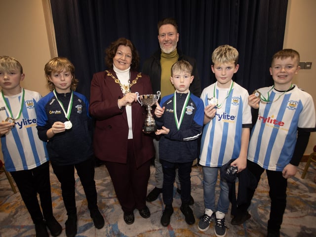 The Mayor, Patricia Logue. pictured at the D&D Youth FA Annual Awards at the City Hotel on Friday night presents Strabane Athletic Colts U11s with the Summer Cup. Included is coach Marcus McDonnell.