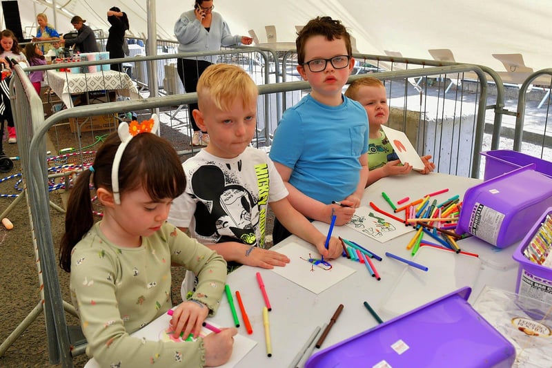 Children at the colouring table during the Cardonagh Family fun Day on Saturday afternoon last. Photo: George Sweeney. DER2327GS - 088