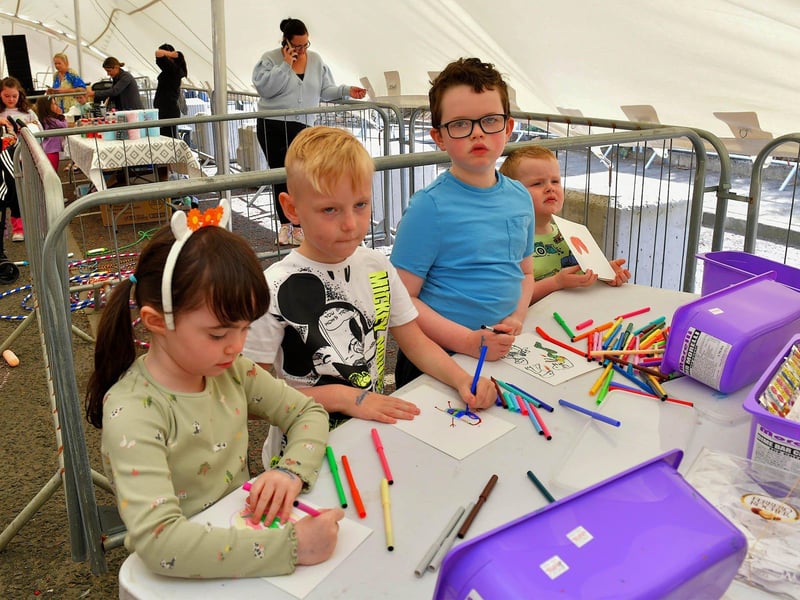 Children at the colouring table during the Cardonagh Family fun Day on Saturday afternoon last. Photo: George Sweeney. DER2327GS - 088