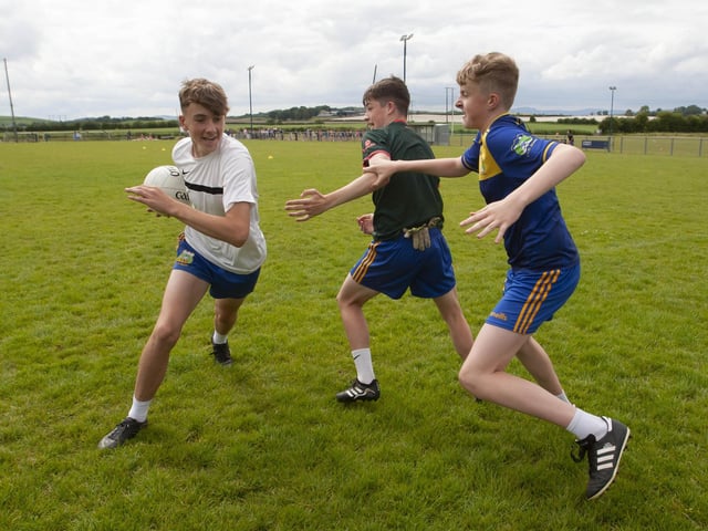 Anton Doherty, Conor Sweeney and Darragh McAuley vying for possession at Burt Skills Day.