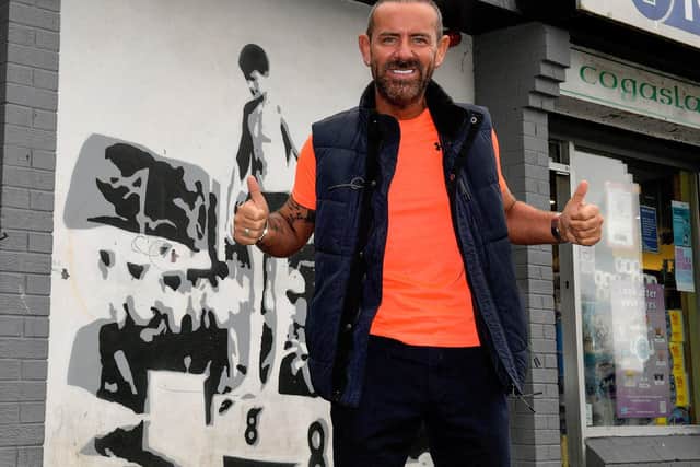 Micky Doherty pictured at the mural of Len Ball in Creggan’s Central Drive. Photo: George Sweeney. DER2317GS – 42