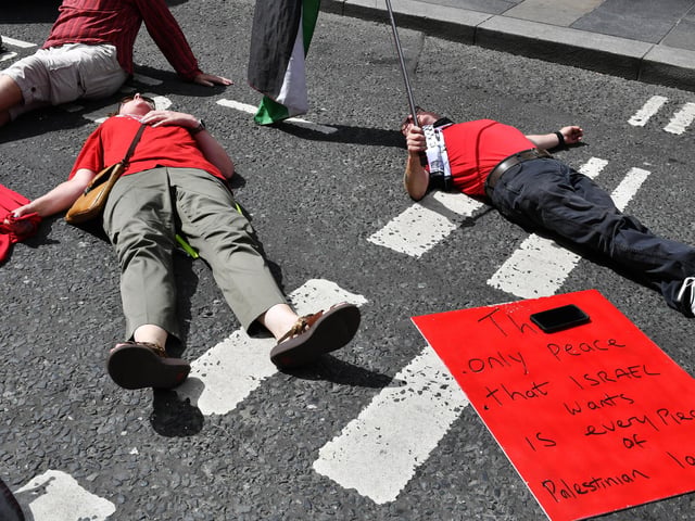 Supporters of the ‘Turn Shipquay Street Red for Gaza’ march on Shipquay Street on Saturday afternoon. Photo: George Sweeney