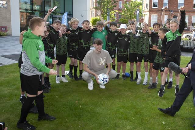 Liverpool and Northern Ireland defender Conor Bradley pictured with young players from St. Patrick’s FC, Castlederg, his former junior club at the launch of the O’Neills Foyle Cup at Ulster University (Magee) on Friday afternoon.