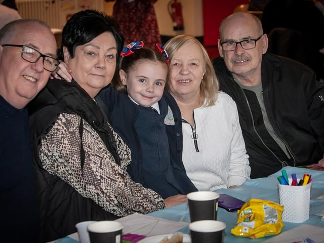 This very proud young lady showing off both sets of grandpaarents at Holy Child PS on Wednesday. (Photos: Jim McCafferty Photography) : .