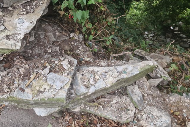 Masonry remained loose and in danger of further collapse.