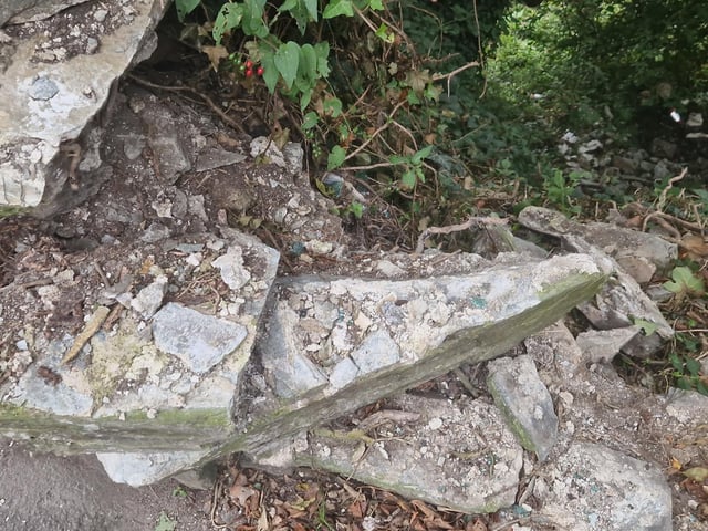 Masonry remained loose and in danger of further collapse.
