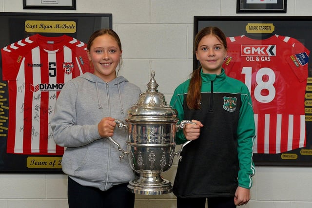 Derry City fans Kirsten and Lauren Mackey pictured with the FAI Cup at the Ryan McBride Brandywell Stadium on Thursday evening last.