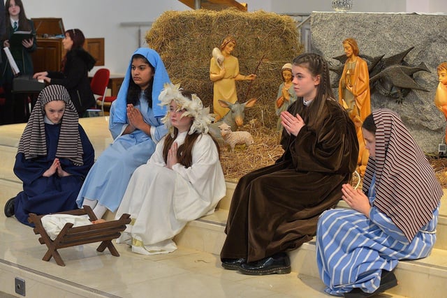 Students from St Cecilia’s College take part in a Nativity scene during a Carol Service held in St Mary’s Church, Creggan, on Tuesday afternoon. Photo: George Sweeney. DER2251GS – 08