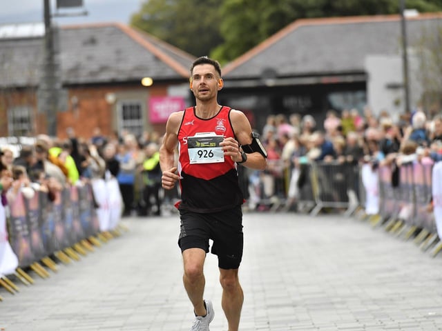 Cathal Kelly, City of Derry Spartans, finishes in eleventh place in the 2025 Waterside Half Marathon. Photo: George Sweeney