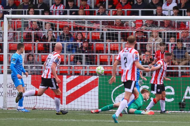 Liam Boyce watches as his strike nestles into the net in the first half.