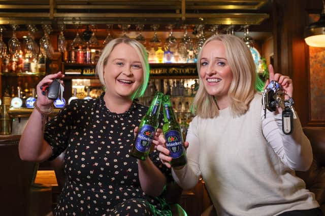 DRIVING HOME FOR CHRISTMAS: (l-r) Gemma Herdman and Maura Bradshaw of Craigavon-based drinks distributor United Wines launch the company’s festive Designated Driver campaign to help Northern Ireland revellers enjoy the Christmas party season and get home safe. Starting from November 18, the initiative will see partygoers who volunteer themselves as a designated driver rewarded with a free Heineken®0.0 or Birra Moretti Zero when they make themselves known to bar staff by showing their car keys at participating venues.