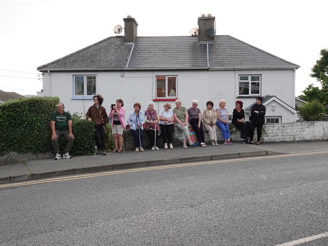 Parishioners await the procession.