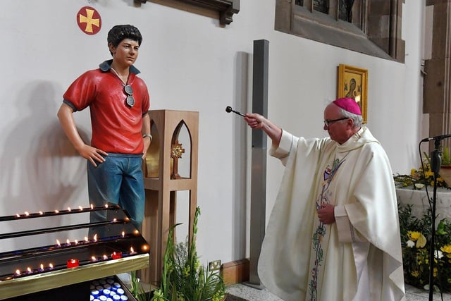 The Most Reverend Dr Donal McKeown, Bishop of Derry blessing of the Blessed Carlos Acutis statue, during Mass on Wednesday morning, as part of the St Eugene’s Cathedral‘s 150 anniversary celebrations. Carlos died in 2006, age 15, from leukaemia. He was a frequent communicant and had been cataloguing reported Eucharistic miracles from around the world before his death. The Italian teenager beatified in 2020.  Photo: George Sweeney.  DER2318GS – 43