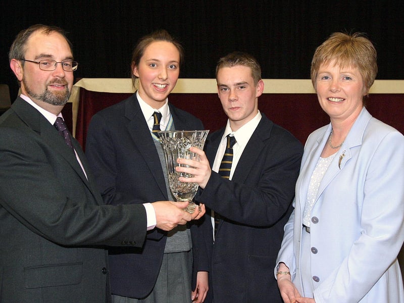 College principal Patrick O'Doherty, presenting the Principal's Award to Clare Gormley and Dairmuid Gallagher, at Lumen Christi College annual Prizegiving ceremony. Included is College vice-principal Rosemary McDaid. (1411T04).:Lumen Christi College prizegiving ceremony in 2003