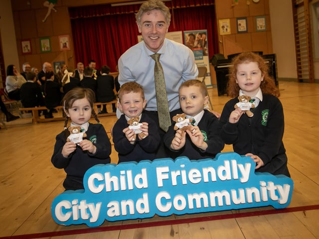CHILD FRIENDLY CITY AND COMMUNITY. . . .Mr. Ian Gallagher, Principal, St. Patrick's Pennyburn pictured with P1 pupils Lana, Reuben, Theo and Emily and their miniature teddy bears at Wednesday's launch. (Photos: Jim McCafferty Photography) : Children’s rights and wellbeing programme.