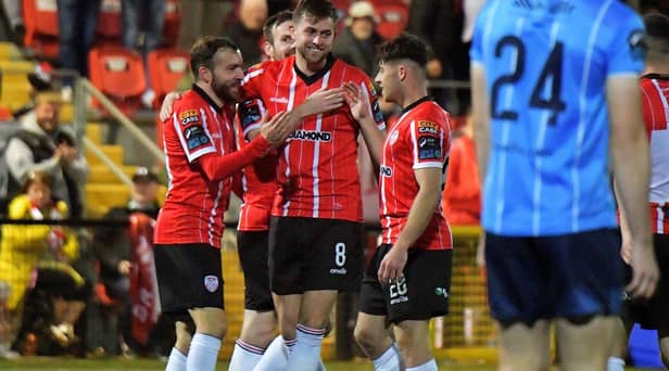 Will Patching celebrates his goal against UCD with Paul McMullen and Adam O’Reilly.    Photo: George Sweeney