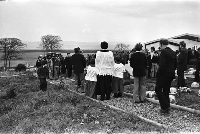 Mourners gather at the graveside during Jim Loughrey funeral in Greysteel in 1976.