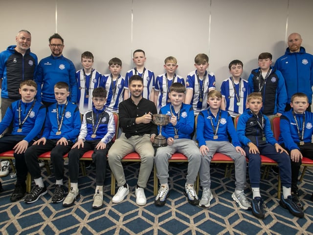 Special guest Stephen McKendry presenting Culmore U-13s with their trophy at the Annual D&D Youth FA awards on Friday night. Included are coaches Jay Quinn, Mark Hanna and Ciaran Black. (Photos: Jim McCafferty Photography)