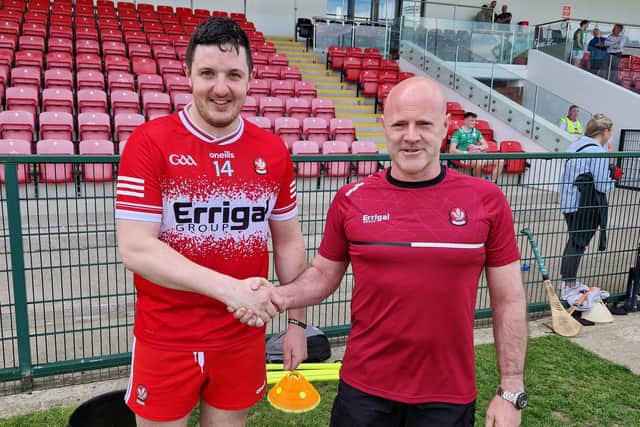 Enda O'Neill from Goal Post NI congratulates 'Man of the Match Christy McNaughton after Saturday's victory over London in Owenbeg.