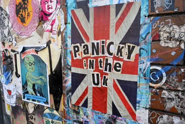 A piece of coronavirus COVID-19 themed street art graffiti is pictured in East London during the novel coronavirus COVID-19 pandemic (Photo: GLYN KIRK/AFP via Getty Images)