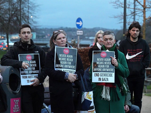 People carry placards at a Holocaust Memorial Day vigil for Gaza, in the Peace Garden, on Saturday afternoon. Photo: George Sweeney