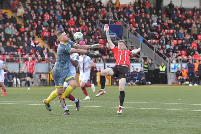 Drogheda United keeper Colin McCabe saves a shot from Derry City's Jamie McGonigle. Photo: George Sweeney
