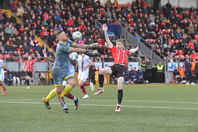 Drogheda United keeper Colin McCabe saves a shot from Derry City's Jamie McGonigle. Photo: George Sweeney