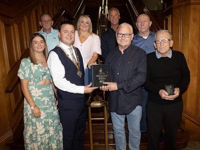 The Mayor of Derry City and Strabane District Council, Ruairi McHugh making a presentation to Martin 'Gills' McGilloway, chair of the Eamonn 'Bronco' Bradley Football Tournament Committee in recognition of their 40th anniversary on Friday evening at the Guildhall. (Photos: Jim McCafferty Photography)