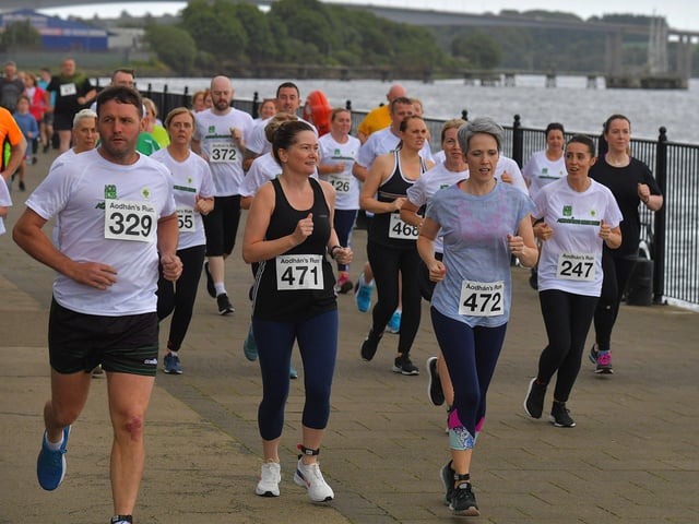 The 2023 Aodhan’s 5k race, run, walk moves along Foyle Embankment towards the Peace Bridge and St Columb’s Park on Thursday evening last. Photo: George Sweeney. DER2326GS – 57