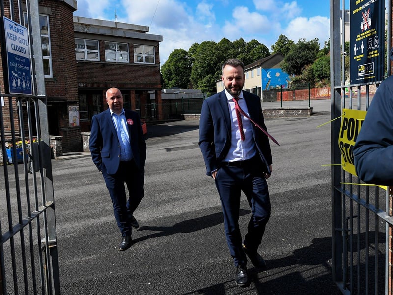 The SDLP leader Colum Eastwood, accompanied by colleague Colr Brian Tierney, leaves The Model Primary School after casting his vote in the Westminster general election.  Photo: George Sweeney.