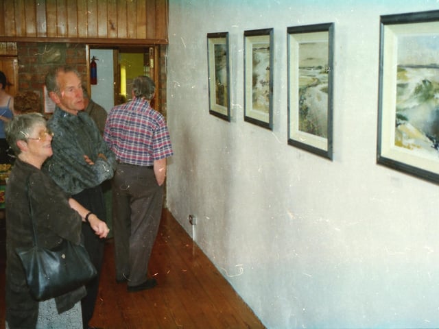 People enjoying an exhibition at Tullyarvan Mill in Buncrana.
