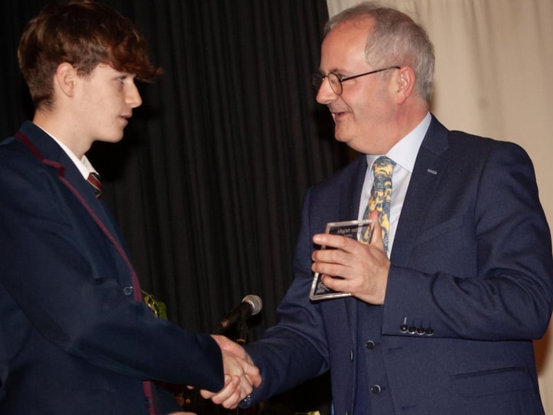 Mr. John Harkin, Principal, Oakgrove Integrated College presenting senior prizes to students.