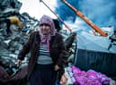 HATAY, TURKEY - FEBRUARY 07: A woman waits for news of her loved ones, believed to be trapped under collapsed building on February 07, 2023 in Iskenderun, Turkey. A 7.8-magnitude earthquake hit near Gaziantep, Turkey, in the early hours of Monday, followed by another 7.5-magnitude tremor just after midday. The quakes caused widespread destruction in southern Turkey and northern Syria and were felt in nearby countries.  (Photo by Burak Kara/Getty Images)