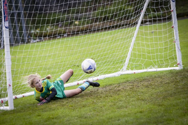 PENALTY SAVE. . . Young Bosco’s keeper Kayla Starrs pulls off a magnificent penalty save during the Sean O’Kane Memorial Cup. (Photo: Jim McCafferty Photography)