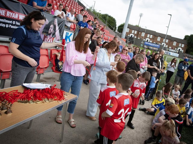 Aisling Hutton, BBHF, Suinin McBride, Ryan's sister and Mayor Patricia Logue handing out medals to participants of the Ryan McBride Cup at Brandywell on Wednesday afternoon.