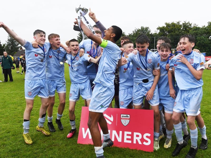 The Derry City team celebrate after lifting the O'Neills Foyle Cup Under-15's trophy at Ardmore on Friday.