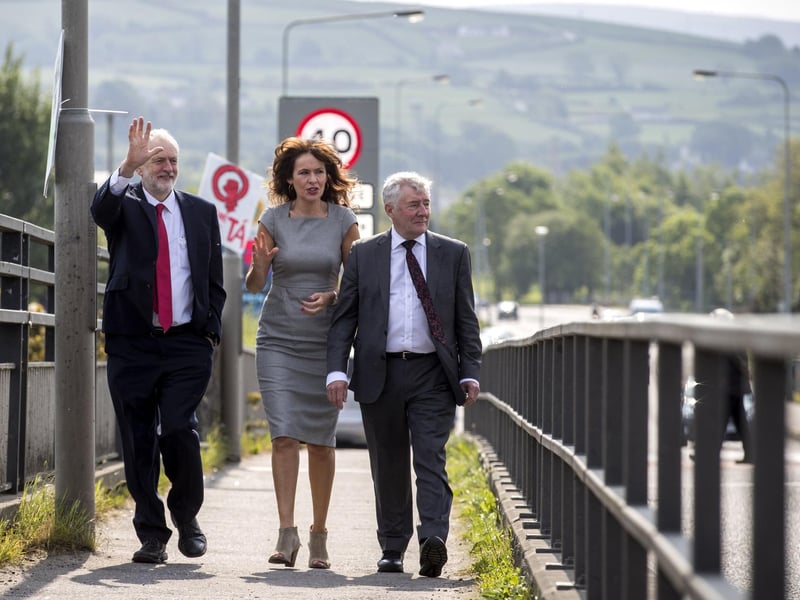 The late Tony Lloyd (right) during a visit to Lifford Bridge in 2018 with the then Labour leader Jeremy Corbyn and Professor Deirdre Heenan. Liam McBurney/PA Wire