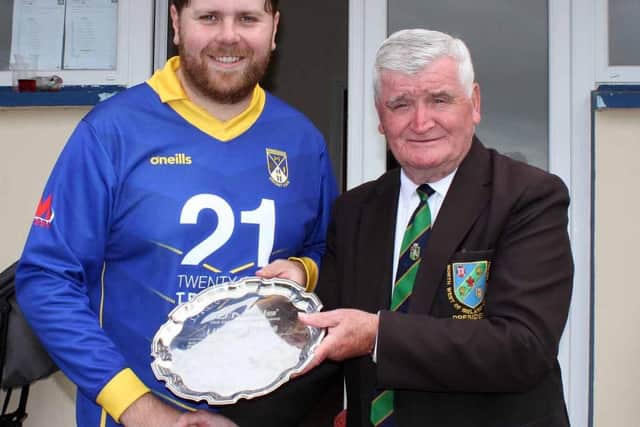 Jamie Huey receives the Ulster Plate from NW President Connie McAllister