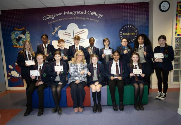 The Head of Year 8 Mrs. Julie-Anne Canning pictured with prizewinners at the Oakgrove Integrated College Junior Prizegiving.