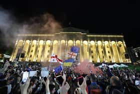 Protesters rally against the 'foreign influence' law outside the parliament in Tbilisi on May 15, 2024. Georgians took to the streets on May 15, 2024 in the latest round of a weeks-long mass protest against a 'foreign influence' law whose adoption by Georgia has prompted a blizzard of international condemnation. Ruling Georgian Dream party lawmakers voted through the legislation on May 14, 2024 in defiance of protesters worried the Caucasus country is shifting away from a pro-Western course towards Russia. (Photo by Giorgi ARJEVANIDZE / AFP) (Photo by GIORGI ARJEVANIDZE/AFP via Getty Images)