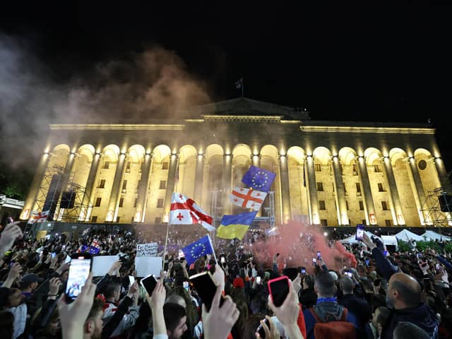 Protesters rally against the 'foreign influence' law outside the parliament in Tbilisi on May 15, 2024. Georgians took to the streets on May 15, 2024 in the latest round of a weeks-long mass protest against a 'foreign influence' law whose adoption by Georgia has prompted a blizzard of international condemnation. Ruling Georgian Dream party lawmakers voted through the legislation on May 14, 2024 in defiance of protesters worried the Caucasus country is shifting away from a pro-Western course towards Russia. (Photo by Giorgi ARJEVANIDZE / AFP) (Photo by GIORGI ARJEVANIDZE/AFP via Getty Images)