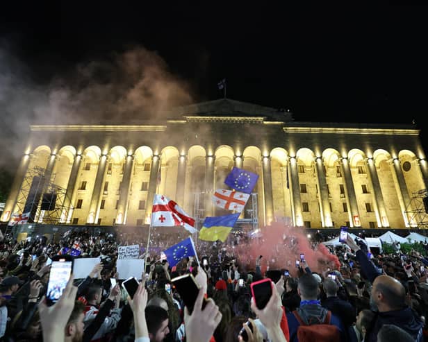 Protesters rally against the 'foreign influence' law outside the parliament in Tbilisi on May 15, 2024. Georgians took to the streets on May 15, 2024 in the latest round of a weeks-long mass protest against a 'foreign influence' law whose adoption by Georgia has prompted a blizzard of international condemnation. Ruling Georgian Dream party lawmakers voted through the legislation on May 14, 2024 in defiance of protesters worried the Caucasus country is shifting away from a pro-Western course towards Russia. (Photo by Giorgi ARJEVANIDZE / AFP) (Photo by GIORGI ARJEVANIDZE/AFP via Getty Images)