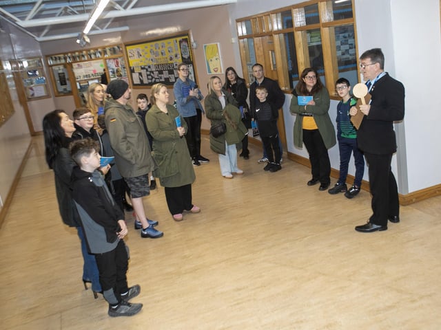 Mr. Donal Chambers, teacher, giving parents and prospective pupils a talk on the layout of the school during Open Day on Saturday.